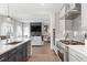 Stylish kitchen seamlessly connecting to the living area, showcasing modern appliances and a functional design at 4781 Saddle Iron Rd, Castle Rock, CO 80104