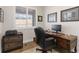 Comfortable home office featuring a wood desk and great lighting at 4781 Saddle Iron Rd, Castle Rock, CO 80104