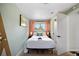 Serene bedroom with a queen bed, soft green walls, and a serene ambiance at 5570 Otis Ct, Arvada, CO 80002