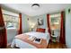 Bright bedroom with warm tones, natural light, and modern decor at 5570 Otis Ct, Arvada, CO 80002