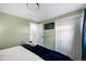 A cozy bedroom with ample closet space and easy access to the bathroom at 5570 Otis Ct, Arvada, CO 80002