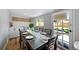 Elegant dining room with a long table and access to the backyard at 5570 Otis Ct, Arvada, CO 80002