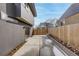 Backyard view showcasing concrete patio and wooden fence at 1459 W 42Nd Ave, Denver, CO 80211