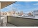 This balcony view reveals the surrounding neighborhood under a bright, blue sky at 1459 W 42Nd Ave, Denver, CO 80211