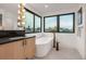 Bright bathroom featuring a modern soaking tub and ample natural light at 1459 W 42Nd Ave, Denver, CO 80211