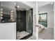Modern bathroom featuring a glass-enclosed shower and contemporary fixtures at 1459 W 42Nd Ave, Denver, CO 80211