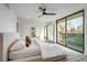 Bright bedroom with access to a private balcony and modern decor at 1459 W 42Nd Ave, Denver, CO 80211