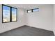 Well-lit bedroom with large windows and plush carpeting at 1459 W 42Nd Ave, Denver, CO 80211