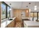 Modern kitchen with sleek cabinetry, quartz countertops, and a large window providing ample natural light at 1459 W 42Nd Ave, Denver, CO 80211