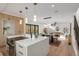 Open-concept kitchen featuring stainless steel appliances, quartz counters, and seamless flow to the living area at 1459 W 42Nd Ave, Denver, CO 80211