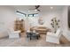 Bright living room with modern decor, a ceiling fan, and a stylish bookshelf at 1459 W 42Nd Ave, Denver, CO 80211