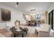 Well-lit living room showcasing a modern design with hardwood floors and comfortable seating at 1459 W 42Nd Ave, Denver, CO 80211