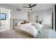 A neutral bedroom with a modern ceiling fan and doorways to other rooms at 1459 W 42Nd Ave, Denver, CO 80211