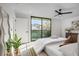Inviting main bedroom featuring a ceiling fan and sliding glass doors at 1459 W 42Nd Ave, Denver, CO 80211