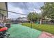 Backyard featuring a trampoline, play set, patio and mature trees at 2560 Westchester Dr, Denver, CO 80221