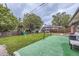 Spacious backyard featuring a lush green lawn, playset, and soccer goal, ideal for Gathering fun and outdoor enjoyment at 2560 Westchester Dr, Denver, CO 80221
