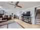 Finished basement featuring a TV, entertainment stand, bar, exercise machine and stairs at 2560 Westchester Dr, Denver, CO 80221