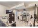 Bedroom featuring exercise equipment, dresser and vanity, and gray floors at 2560 Westchester Dr, Denver, CO 80221