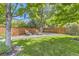 Serene backyard with a seating area, hammock, and a privacy fence at 4498 Buena Vista Ct, Castle Rock, CO 80109