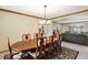 Formal dining room with a large wooden table, seating for eight, and classic decor at 4498 Buena Vista Ct, Castle Rock, CO 80109