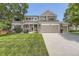 Charming two-story home with a well-manicured lawn and a three car attached garage at 4498 Buena Vista Ct, Castle Rock, CO 80109