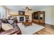 Comfortable living room with a fireplace and built-in shelving at 4498 Buena Vista Ct, Castle Rock, CO 80109