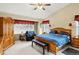 Serene main bedroom featuring a king-size bed, large windows, and ample closet space at 4498 Buena Vista Ct, Castle Rock, CO 80109