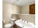 Elegant powder room featuring a modern sink, tiled accent wall, and a large mirror at 4498 Buena Vista Ct, Castle Rock, CO 80109
