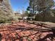 A wooden deck overlooking a lush backyard with mature trees and garden areas, with long benches at 5138 S Sedalia Ct, Centennial, CO 80015