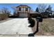 Charming two-story home featuring a well-maintained lawn, long driveway and attached garage at 5138 S Sedalia Ct, Centennial, CO 80015