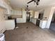 Spacious kitchen with white cabinets, ample counter space, and stainless-steel appliances at 5138 S Sedalia Ct, Centennial, CO 80015