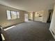 Open-concept living area with access to the kitchen and an adjacent fireplace at 5138 S Sedalia Ct, Centennial, CO 80015