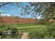 Well-maintained green space with brick wall and mature trees at 1198 Milo Cir # A, Lafayette, CO 80026