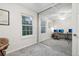 Bright bedroom featuring mirrored closet doors, carpeted floors, and a window with natural light at 1198 Milo Cir # A, Lafayette, CO 80026