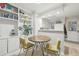 Bright dining area featuring built in shelves that connect to kitchen at 1198 Milo Cir # A, Lafayette, CO 80026