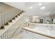 Kitchen with dishwasher adjacent to the staircase and living room at 1198 Milo Cir # A, Lafayette, CO 80026