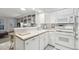 Well-maintained kitchen featuring white cabinetry and modern appliances at 1198 Milo Cir # A, Lafayette, CO 80026