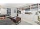 Bright living room with custom built-in bookshelves and a large window at 1198 Milo Cir # A, Lafayette, CO 80026