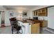 Basement bar with wooden countertop, sink and cabinets, ideal for entertaining guests at 51 West Ranch Trl, Morrison, CO 80465