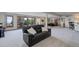 Spacious finished basement with large windows, pool table, sitting area and bar, perfect for relaxing at 51 West Ranch Trl, Morrison, CO 80465