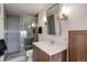 Stylish bathroom featuring a glass shower, a white vanity with modern fixtures, and sleek lighting at 51 West Ranch Trl, Morrison, CO 80465