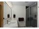 Modern bathroom featuring a glass-enclosed shower, sleek vanity, and contemporary finishes at 51 West Ranch Trl, Morrison, CO 80465