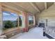 A rustic bedroom featuring log walls, stone fireplace, and scenic views from large windows at 51 West Ranch Trl, Morrison, CO 80465