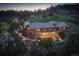 Stunning log home exterior featuring a stone foundation, metal roof, and picturesque hillside setting at 51 West Ranch Trl, Morrison, CO 80465