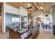 Spacious kitchen with an island, modern appliances, and wood beams under a bright skylight at 51 West Ranch Trl, Morrison, CO 80465