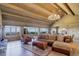 An inviting living room with large windows showcasing scenic views and comfortable seating at 51 West Ranch Trl, Morrison, CO 80465