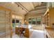 Charming wood-paneled office with built-in shelving and large windows overlooking the landscape at 51 West Ranch Trl, Morrison, CO 80465