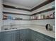 Walk-in pantry with generous counter space, sink, and storage shelving for kitchen supplies at 51 West Ranch Trl, Morrison, CO 80465