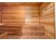 Inviting cedar sauna for relaxation and wellness, featuring wooden benches and traditional design at 51 West Ranch Trl, Morrison, CO 80465