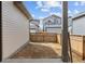 Backyard with new construction surrounded by a wooden privacy fence at 21204 E 63Rd Dr, Aurora, CO 80019